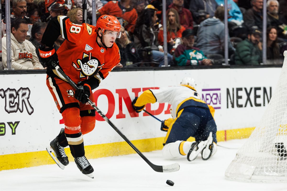 Anaheim Ducks defenseman Pavel Mintyukov (98) defends puck while dodging another player during an NHL hockey game against the Nashville Predators, Tuesday April 7, 2026 in Anaheim, Calif. Anaheim Ducks defenseman Pavel Mintyukov (98) defends puck while dodging another player during an NHL hockey game against the Nashville Predators, Tuesday April 7, 2026 in Anaheim, Calif.