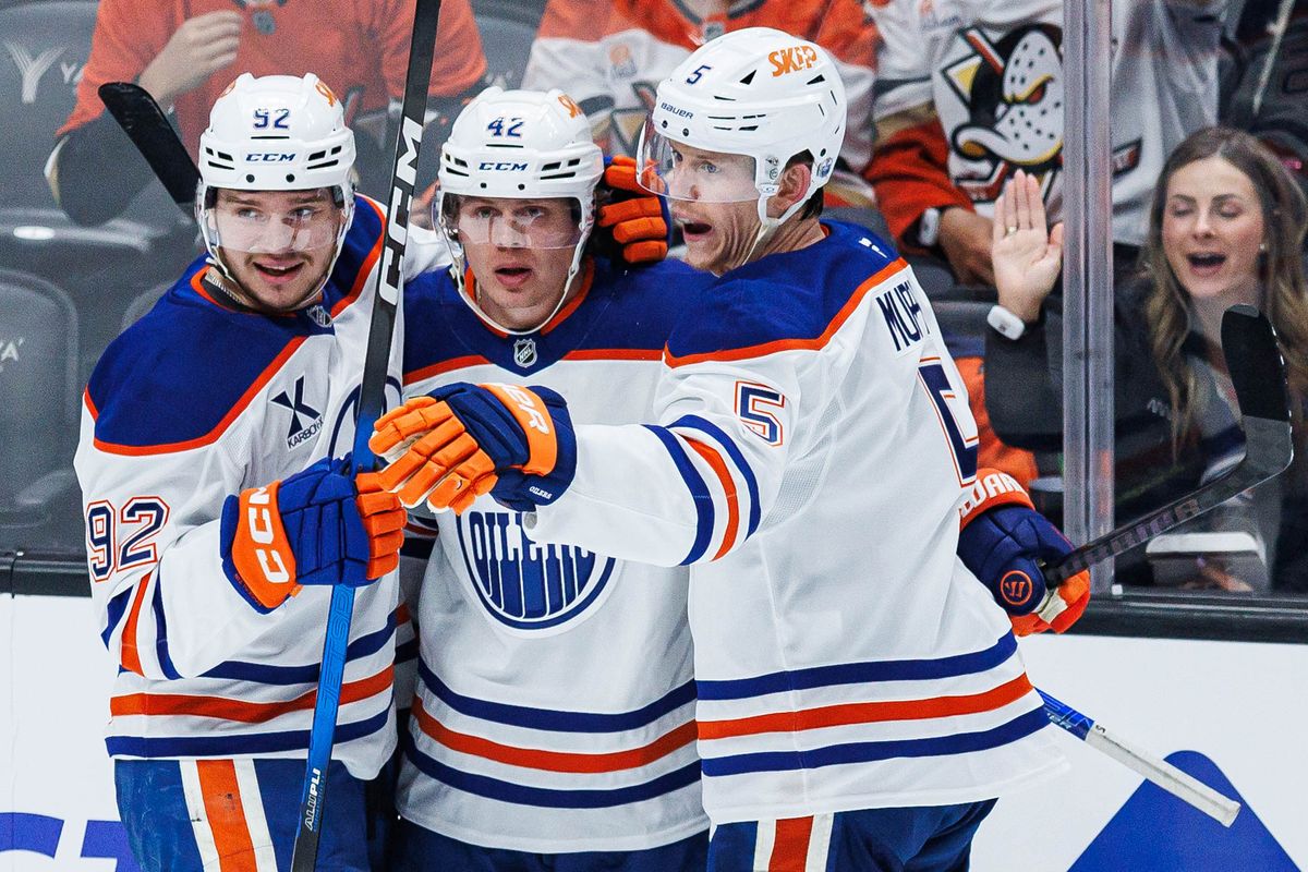 Kasperi Kapanen #42 of the Edmonton Oilers (center) celebrates with teammates Vasily Podkolzin #92 (left) and Connor Murphy #5 (right after scoring a goal during an NHL Playoffs game against the Anaheim Ducks on April 24, 2026 at Honda Center in Anaheim, California.