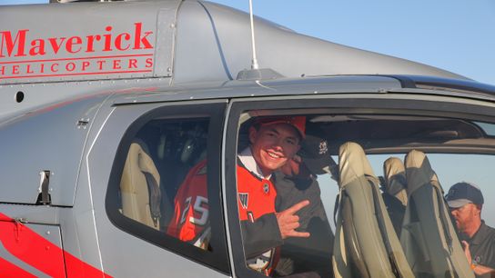 Roger McQueen boarding a helicopter from Los Angeles to the Disneyland