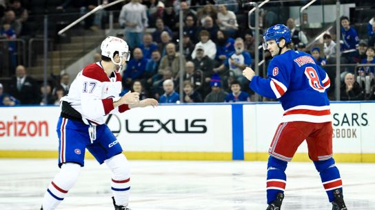 Nov 30, 2024; New York, New York, USA; Montreal Canadiens right wing Josh Anderson (17) and New York Rangers defenseman Jacob Trouba (8) fight during the first period at Madison Square Garden.