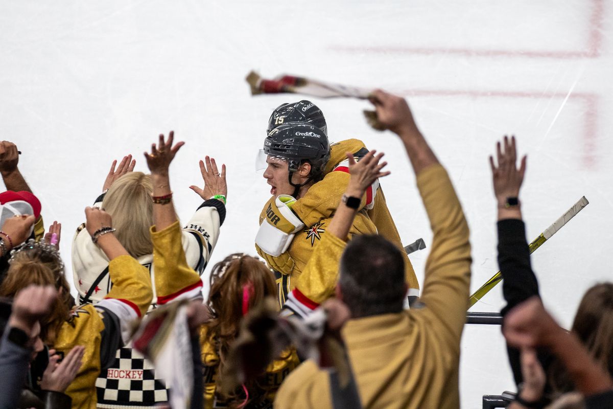Las Vegas Golden Knights center Bret Howden (21) and defenseman Noah Hanifin (15) celebrate while fans cheer them on after winning in overtime during an NHL game against Utah Hockey Club on Saturday November 2, 2024 in Las Vegas. Las Vegas Golden Knights center Bret Howden (21) and defenseman Noah Hanifin (15) celebrate while fans cheer them on after winning in overtime during an NHL game against Utah Hockey Club on Saturday November 2, 2024 in Las Vegas.