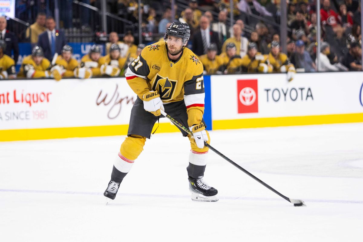 Las Vegas Golden Knights Defenseman Shea Theodore (27) looks to shoot the puck during an NHL game between the Las Vegas Golden Knights and the Carolina Hurricanes, Monday November 11, 2024 in Las Vegas, Nev.