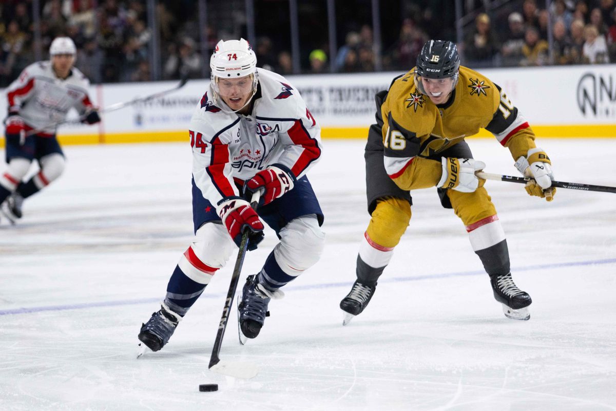 Washington Capitals defenseman John Carlson (74) skates the puck up the ice while being chased by Las Vegas Golden Knights left-wing Pavel Dorofeyev (16) during an NHL game between the Las Vegas Golden Knights and the Washington Capitals, Sunday November 17, 2024 in Las Vegas, Nev. Washington Capitals defenseman John Carlson (74) skates the puck up the ice while being chased by Las Vegas Golden Knights left-wing Pavel Dorofeyev (16) during an NHL game between the Las Vegas Golden Knights and the Washington Capitals, Sunday November 17, 2024 in Las Vegas, Nev.