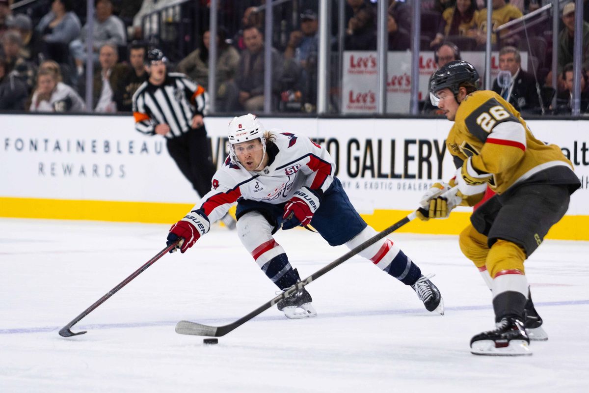 Washington Capitals defenseman Jakub Chychrun (6) looks to poke the puck out of Las Vegas Golden Knights right-wing Alexander Holtz’ (26) possession during an NHL game between the Las Vegas Golden Knights and the Washington Capitals, Sunday November 17, 2024 in Las Vegas, Nev. Washington Capitals defenseman Jakub Chychrun (6) looks to poke the puck out of Las Vegas Golden Knights right-wing Alexander Holtz’ (26) possession during an NHL game between the Las Vegas Golden Knights and the Washington Capitals, Sunday November 17, 2024 in Las Vegas, Nev.