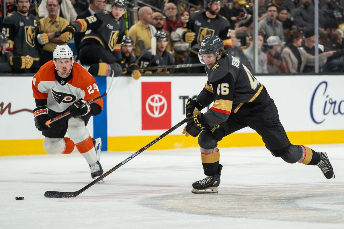 Vegas Golden right wing Jonas Rondbjerg (46) skates the puck down the ice while trying to escape Flyer’s defenseman Nick Seeler (24) during NHL game against Philadelphia Flyers on Monday Jan. 2, 2025 in Las Vegas.
