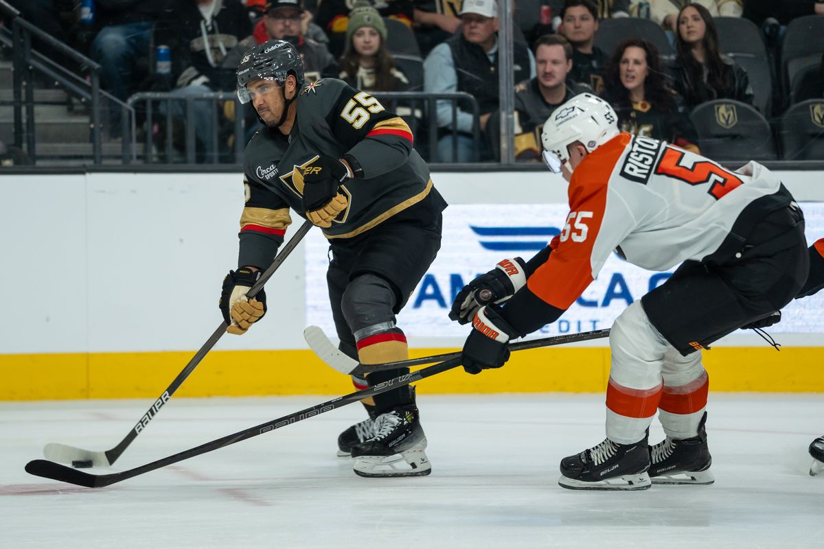Vegas Golden right wing Keegan Kolesar (55) scans the ice while trying to escape Flyers defenseman Rasmussen Ristolainen (55) skates the puck down the ice while trying to escape Flyer’s defenseman Nick Seeler (24) during NHL game against Philadelphia Flyers on Monday Jan. 2, 2025 in Las Vegas.