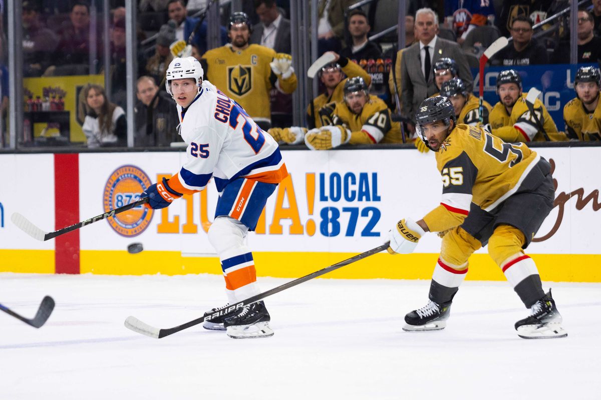 New York Islanders defenseman Dennis Cholowski (25) clears the puck into the offensive zone during a NHL game between the Las Vegas Golden Knights and the New York Islanders, Thursday January 9, 2025 in Las Vegas, Nev.