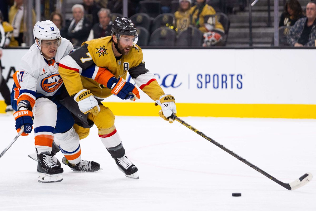 New York Islanders left wing Anders Lee (27) and Las Vegas Golden Knights defenseman Alex Pietrangelo (7) fight over possession of the puck during a NHL game between the Las Vegas Golden Knights and the New York Islanders, Thursday January 9, 2025 in Las Vegas, Nev.