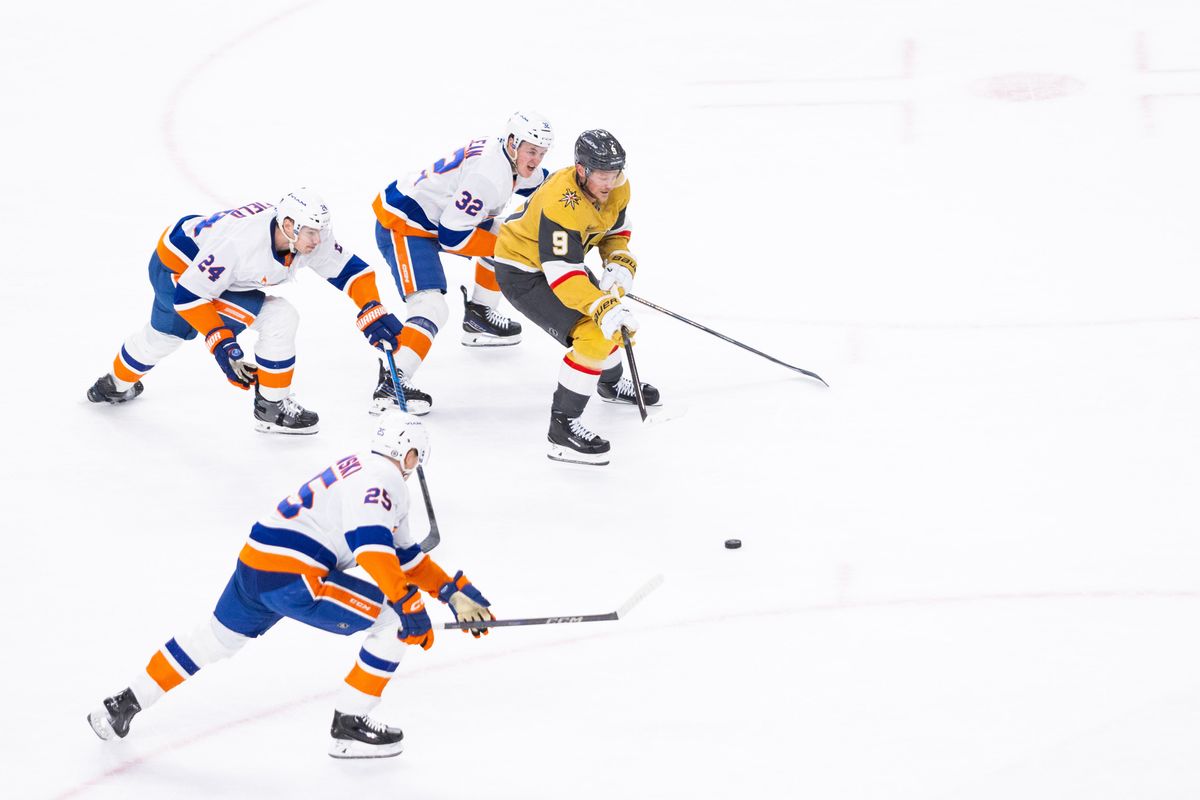 Las Vegas Golden Knights center Jack Eichel (9) skates the puck past New York Islanders’ defenders during a NHL game between the Las Vegas Golden Knights and the New York Islanders, Thursday January 9, 2025 in Las Vegas, Nev.