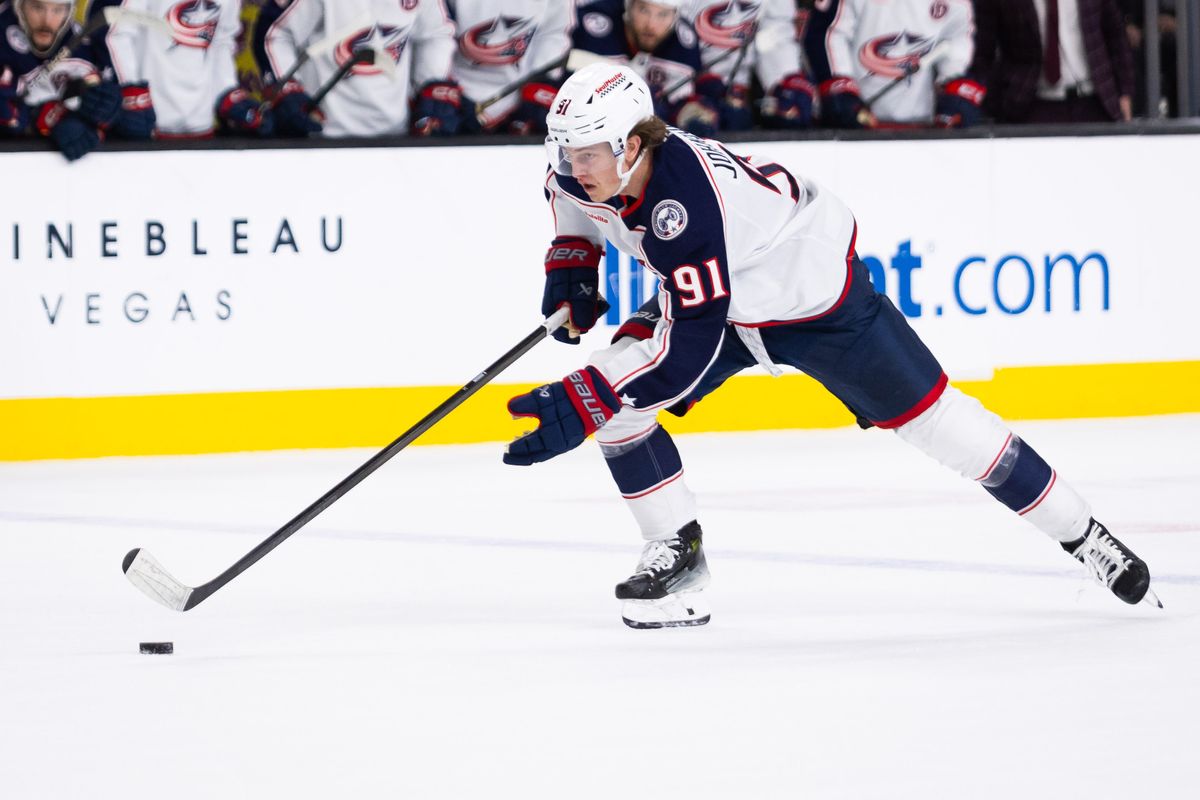 Columbus Blue Jackets center Kent Johnson (91) skates the puck on a breakaway in overtime during a NHL game between the Las Vegas Golden Knights and the Columbus Blue Jackets, Thursday January 30, 2025 in Las Vegas, Nev.