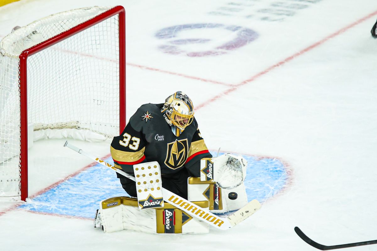 Vegas Golden Knights G Adin Hill (33) makes a save during the third period of an NHL game against the New Jersey Devils on Sunday March 02, 2025, at T-Mobile Arena. 