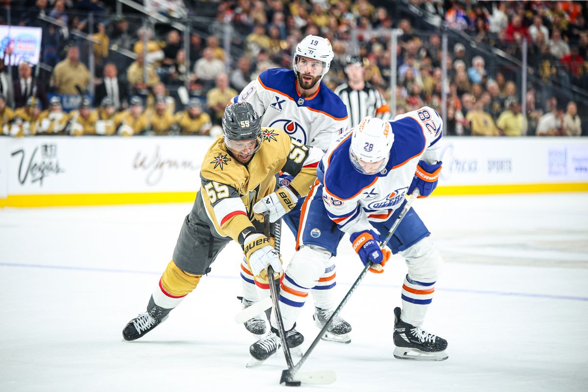 Vegas Golden Knights RW Keegan Kolesar (55) battles with Edmonton Oilers RW Connor Brown (28) for the puck during the third period of an NHL game on Tuesday April 01, 2025 at T-Mobile Arena in Las Vegas, Nevada. 