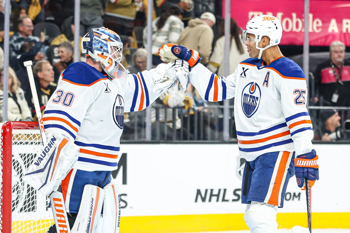 Edmonton Oilers G Calvin Pickard (30) and Edmonton Oilers D Darnell Nurse (25) high five after defeating the Vegas Golden Knights on Tuesday April 01, 2025 at T-Mobile Arena in Las Vegas, Nevada. 