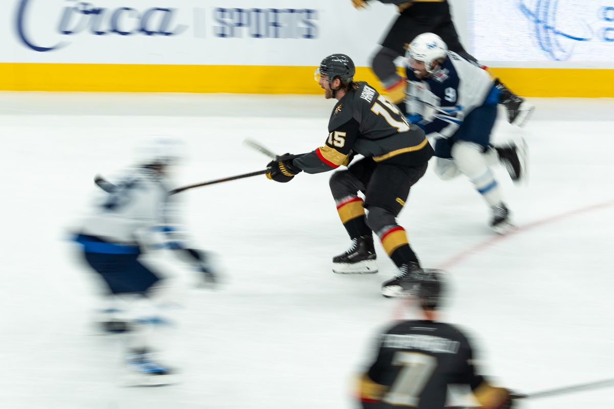 Vegas Golden Knights defenseman Noah Hanifan (15) skates the puck down the ice during first period of NHL game against Winnipeg Jets on Thursday April 3, 2025 in Las Vegas.