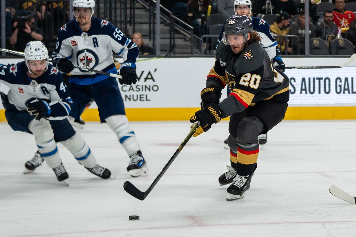Vegas Golden Knights left wing Brandon Saad (20) skates the puck down the ice during third period of NHL game against Winnipeg Jets on Thursday April 3, 2025 in Las Vegas.
