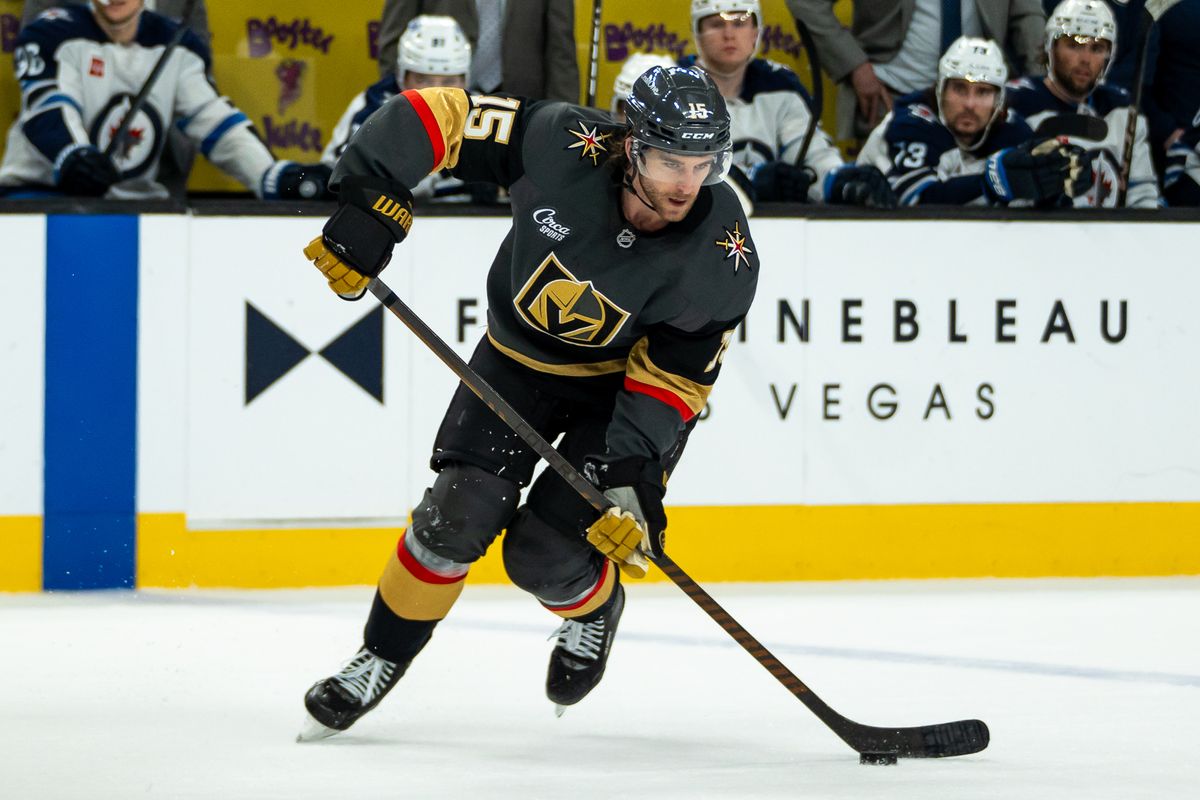 Vegas Golden Knights defenseman Noah Hanifin (15) prepares to pass the puck down the ice during third period of NHL game against Winnipeg Jets on Thursday April 3, 2025 in Las Vegas.  