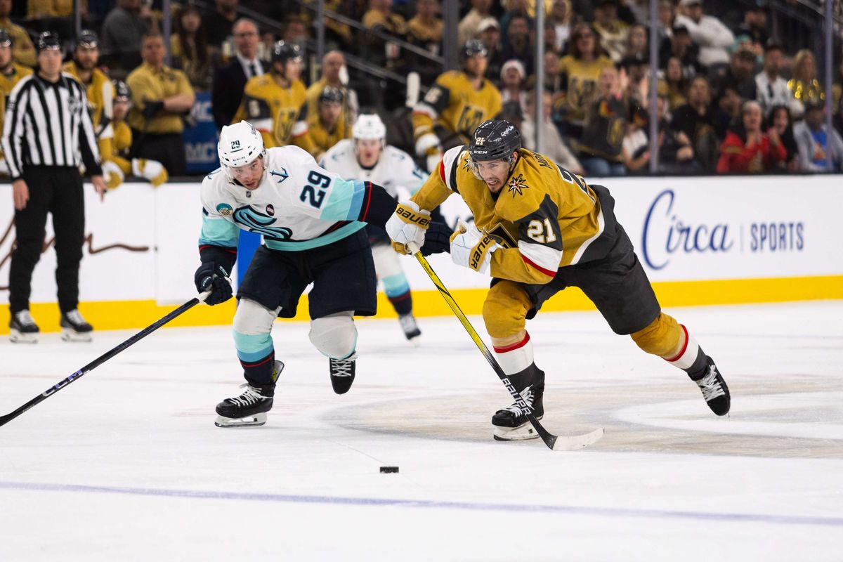Las Vegas Golden Knights center Brett Howden (21) goes on a breakaway as Seattle Kraken defenseman Vince Dunn (29) chases after him during a NHL game between the Las Vegas Golden Knights and the Seattle Kraken, Thursday April 10, 2025 in Las Vegas, Nev.