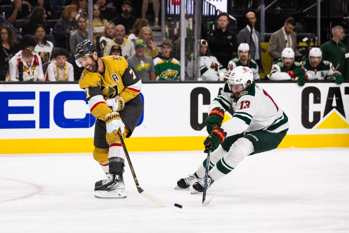 Las Vegas Golden Knights defenseman Alex Pietrangelo (7) tries to clear the puck out of the zone while Minnesota Wild center Yakov Trenin (13) attempts to deflect the puck during a NHL playoff game between the Las Vegas Golden Knights and the Minnesota Wild, Tuesday April 22, 2025 in Las Vegas, Nev. Las Vegas Golden Knights defenseman Alex Pietrangelo (7) tries to clear the puck out of the zone while Minnesota Wild center Yakov Trenin (13) attempts to deflect the puck during a NHL playoff game between the Las Vegas Golden Knights and the Minnesota Wild, Tuesday April 22, 2025 in Las Vegas, Nev.