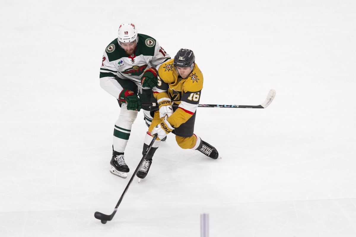 Las Vegas Golden Knights left-wing Pavel Dorofeyev (16) is checked by Minnesota Wild center Yakov Trenin (13) during a NHL playoff game between the Las Vegas Golden Knights and the Minnesota Wild, Tuesday April 22, 2025 in Las Vegas, Nev. Las Vegas Golden Knights left-wing Pavel Dorofeyev (16) is checked by Minnesota Wild center Yakov Trenin (13) during a NHL playoff game between the Las Vegas Golden Knights and the Minnesota Wild, Tuesday April 22, 2025 in Las Vegas, Nev.