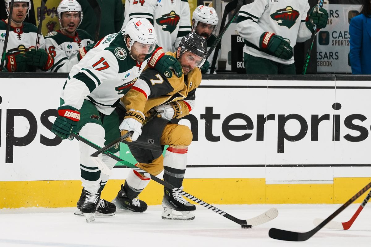 Vegas Golden Knights defenseman Alex Pietrangelo (7) and Minnesota left wing Marcus Foligno (17) battle for control of the puck during second period of NHL playoff game against Minnesota Wild on Tuesday April 29, 2025 in Las Vegas.