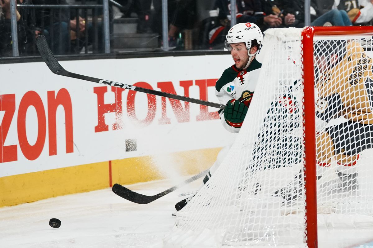 Minnesota Wild defenseman Brock Faber (7) skates around the net attempting to gain control of the puck during overtime of NHL playoff game against Vegas Golden Knights on Tuesday April 29, 2025 in Las Vegas.