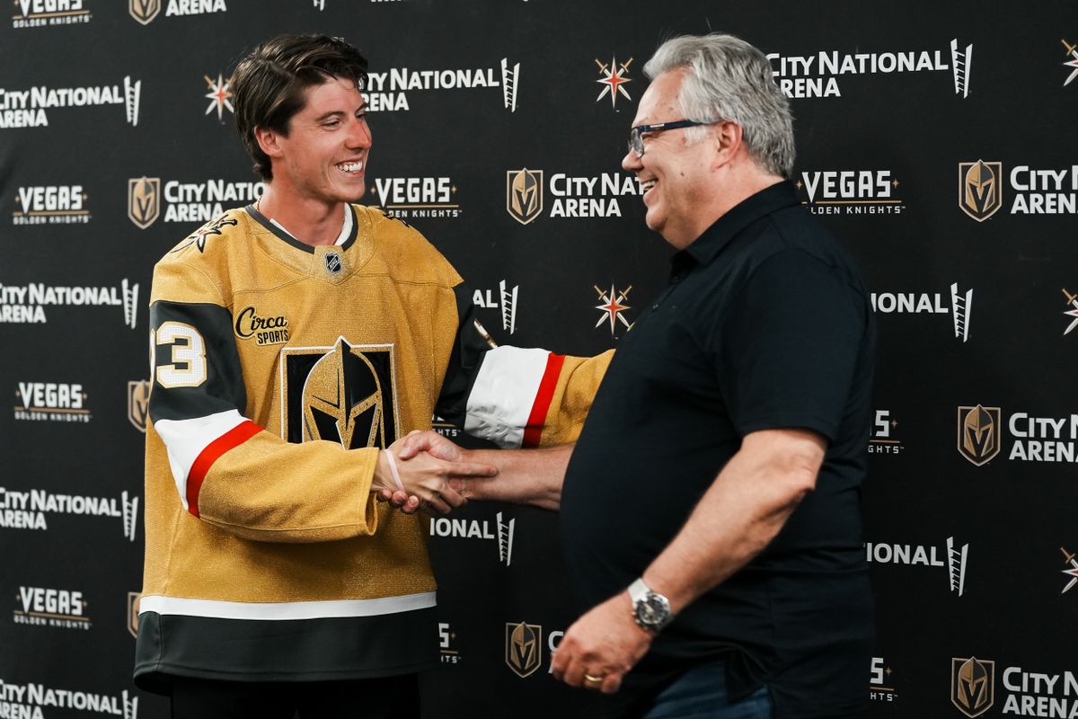 Mitch Marner (left) shakes hands with Vegas Golden Knights general manager Kelly McCrimmon (right) at a press conference on Tuesday July 1, 2025 in Las Vegas. Mitch Marner (left) shakes hands with Vegas Golden Knights general manager Kelly McCrimmon (right) at a press conference on Tuesday July 1, 2025 in Las Vegas.