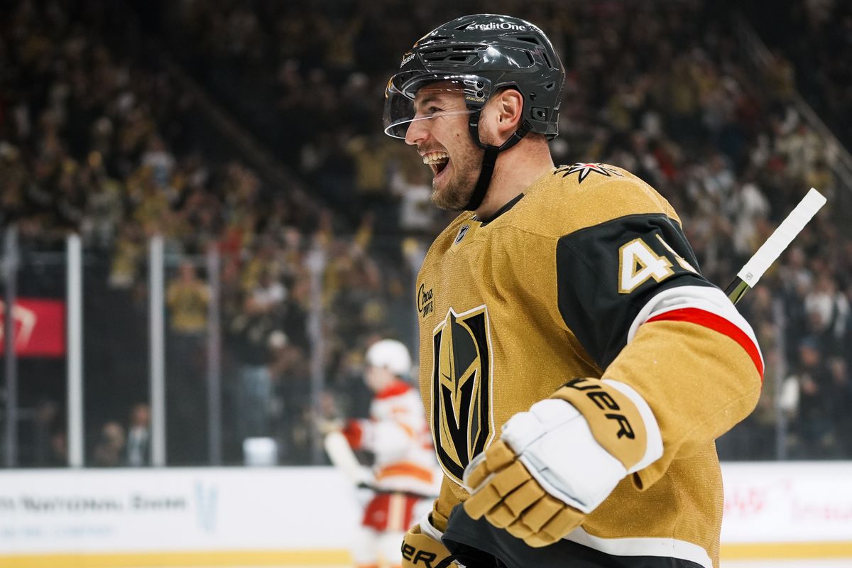 Vegas Golden Knights left wing Ivan Barbashev (49) celebrates after assisting teammate Mitch Marner with a goal during first period of NHL game against Calgary Flames  on Saturday, Oct. 18, 2025 at T-Mobile Arena in Las Vegas.