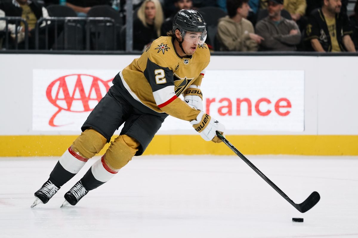 Vegas Golden Knights defensemen Zach Whitecloud (2) takes the puck down the ice second period of NHL game against Calgary Flames  on Saturday, Oct. 18, 2025 at T-Mobile Arena in Las Vegas.