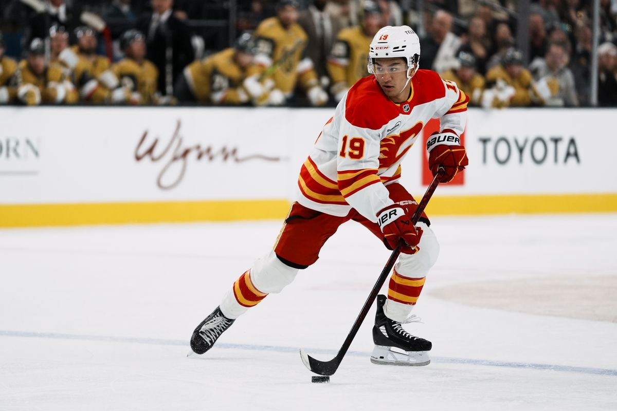 Calgary Flames defenseman Zayne Parekh (19) takes the puck down the ice during second period of NHL game against Vegas Golden Knights on Saturday, Oct. 18, 2025 at T-Mobile Arena in Las Vegas.