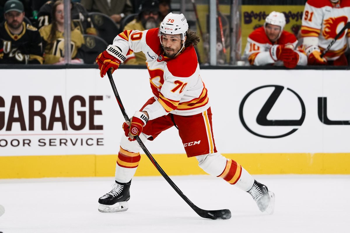 Calgary Flames left wing Ryan Lomberg (70) shoots the puck during second period of NHL game against Vegas Golden Knights on Saturday, Oct. 18, 2025 at T-Mobile Arena in Las Vegas.