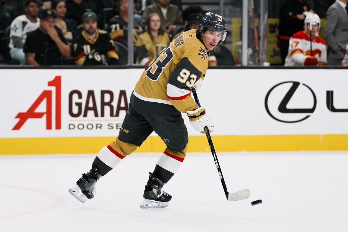 Vegas Golden Knights right wing Mitch Marner (93) eyes the puck after passing it during second period of NHL game against Calgary Flames  on Saturday, Oct. 18, 2025 at T-Mobile Arena in Las Vegas.