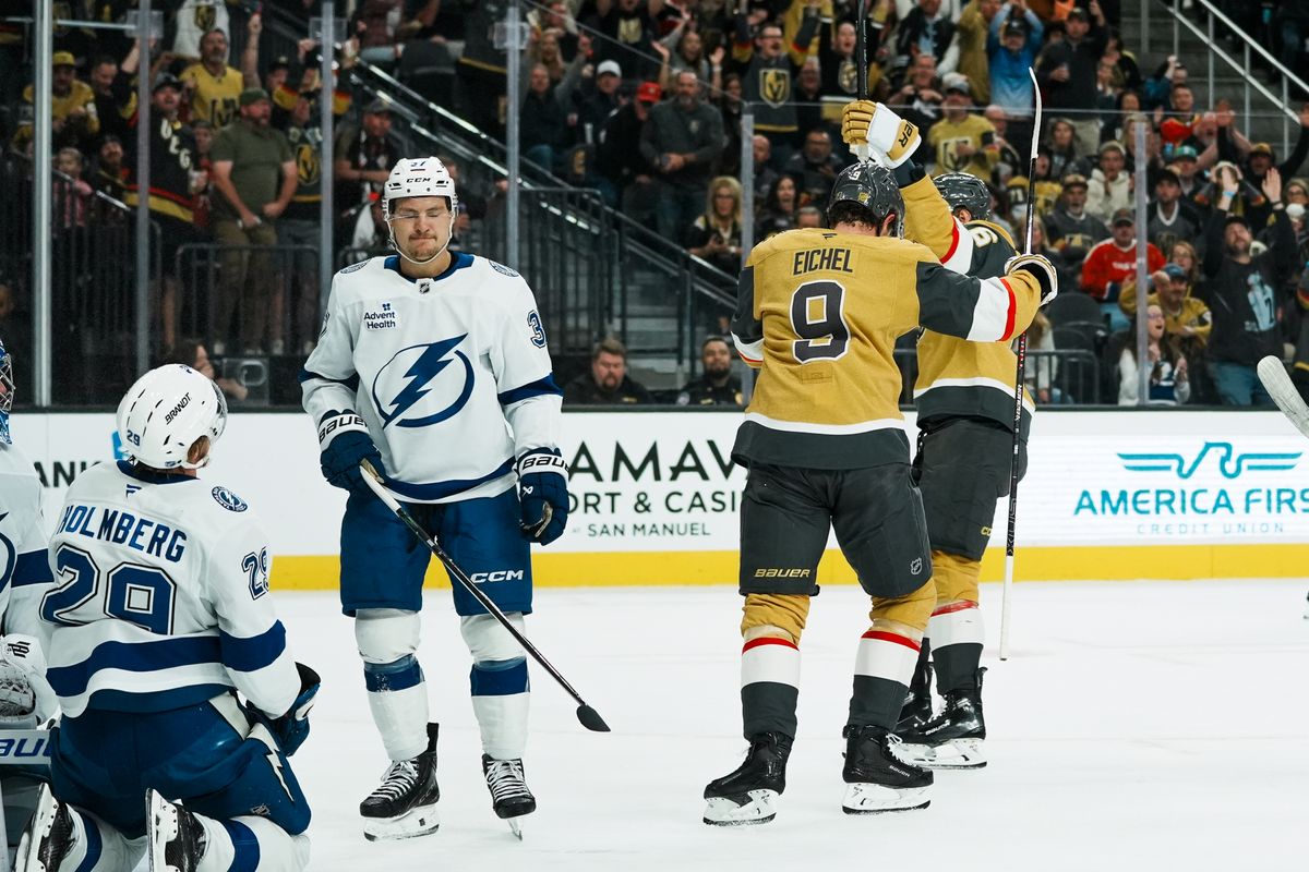 Tampa Bay Lightning center Yanni Gourde (37) reacts to the Vegas Golden Knights scoring a goal while Golden Knights center Jack Eichel (9) and defenseman Kaeden Korczak (6) celebrate during first period of NHL game against Vegas Golden Knights on Tuesday, Nov. 6, 2025 at T-Mobile Arena in Las Vegas.