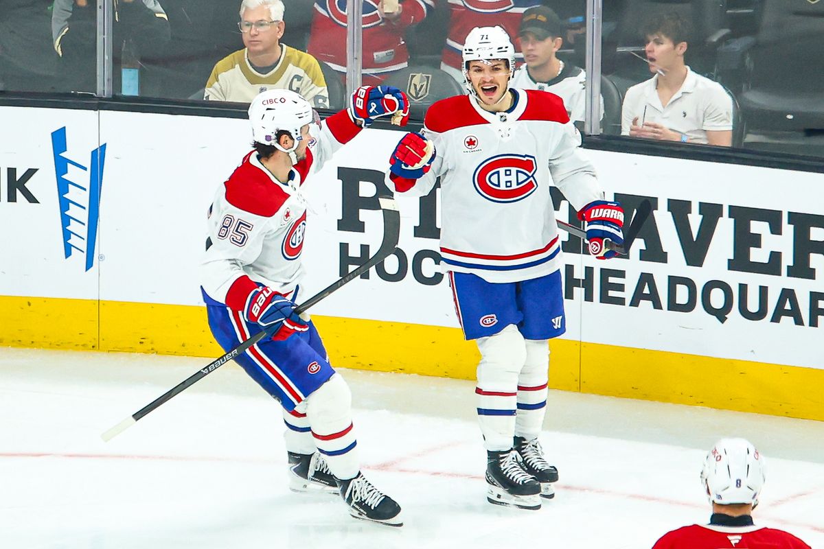 Montreal Canadiens F Alexandre Texier (85) and F Jake Evans (71) celebrate after scoring a goal against the Vegas Golden Knights on Friday November 28, 2025, in Las Vegas, Nevada. 