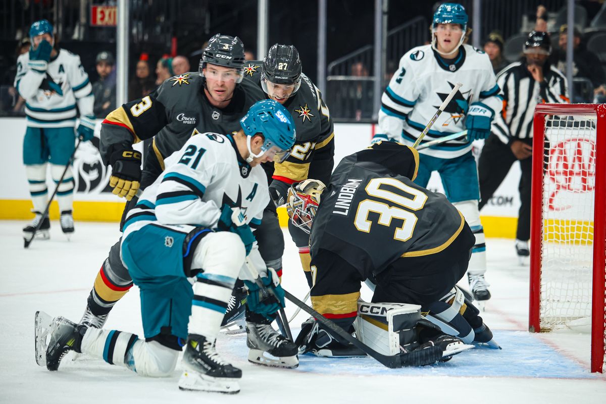 Vegas Golden Knights G Carl Lindbom (30) makes a save against San Jose Sharks F Alexander Wennberg (21) during the third period of an NHL game on Saturday November 29, 2025, in Las Vegas, Nevada. 