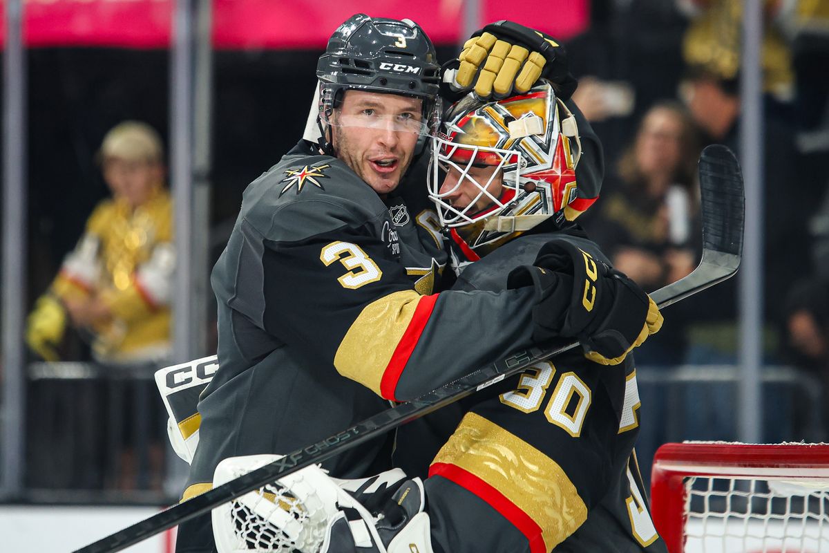Vegas Golden Knights D Brayden McNabb (3) and Vegas Golden Knights G Carl Lindbom (30) embrace after Lindbom secures his first career win against the San Jose Sharks on Saturday November 29, 2025, in Las Vegas, Nevada. 