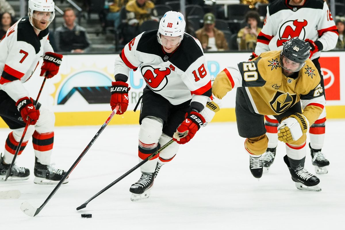 Vegas Golden Knights left wing Brandon Saad attempts to gain control of the puck from Devils Ondrej Palat (18) during second period of NHL game against New Jersey Devils on Wed., Dec. 17, 2025, at T-Mobile Arena in Las Vegas.