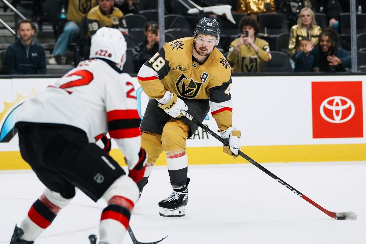 Golden Knights center Tomas Hertl (48) prepares to attempt a pass past Devils Brett Pesce (22) during third period of NHL game against New Jersey Devils on Wed., Dec. 17, 2025, at T-Mobile Arena in Las Vegas.