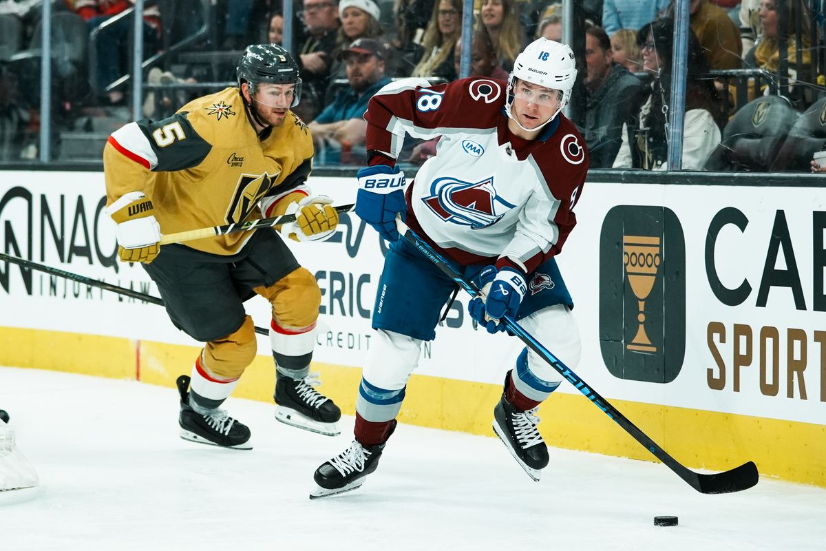 Colorado Avalanche center Jack Drury scans the ice while attempting to escape Golden Knights defenseman Jeremy Lauzon (5) during second period of NHL game against Vegas Golden Knights on Saturday Dec. 27, 2025 at T-Mobile Arena in Las Vegas.