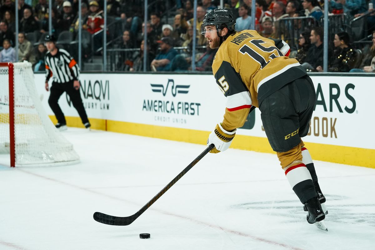 Vegas Golden Knights defenseman Noah Hanifin (15) takes the puck away from the goal during third period of NHL game against Colorado Avalanche on Saturday, Dec. 27, 2025 at T-Mobile Arena in Las Vegas.