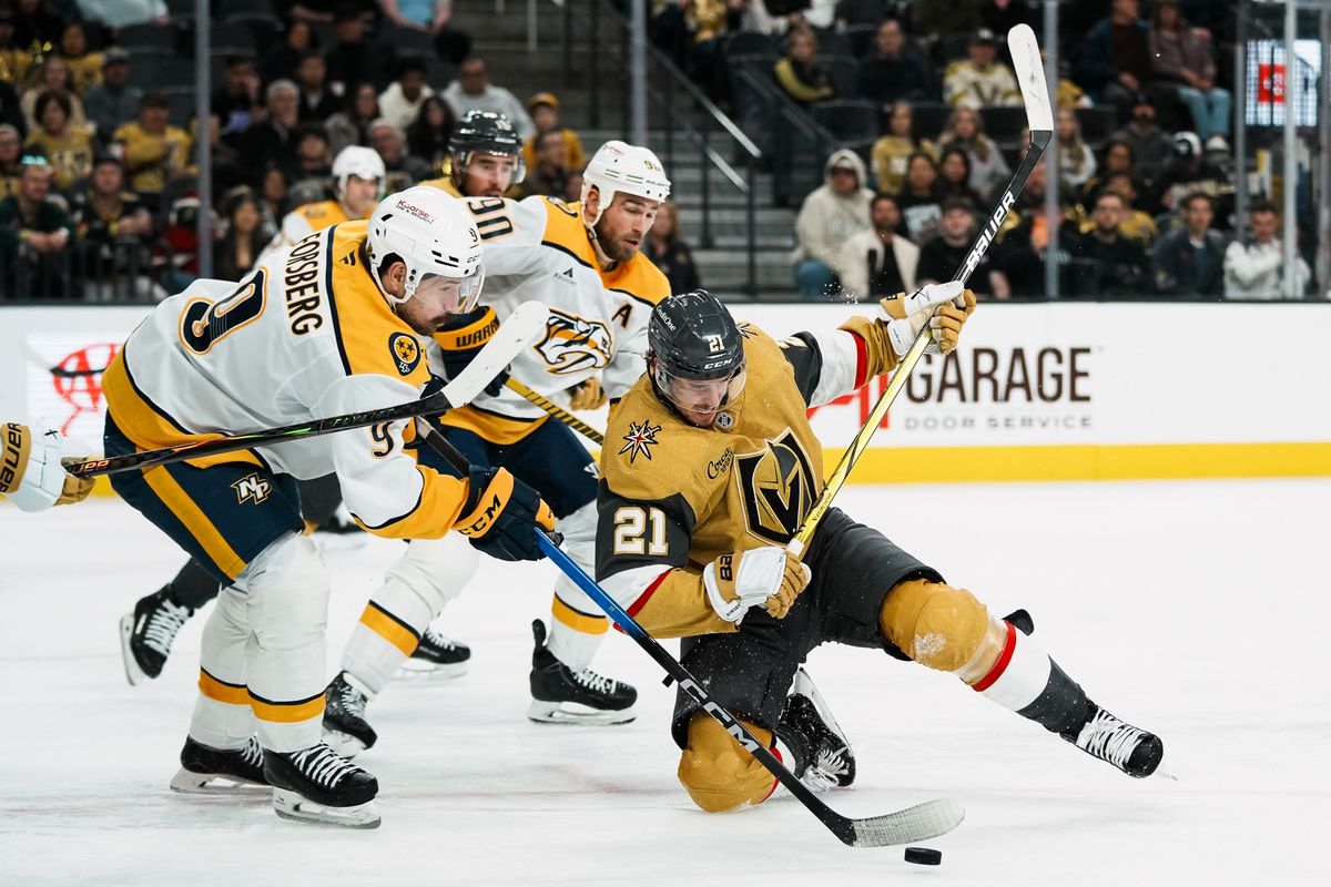 Vegas Golden Knights center Brett Howden (21) and Predators left wing Filip Forsberg (9) and center Ryan O’Reilly (90) collide going after the puck during third period of NHL game against Nashville Predators on Wed. Dec. 31, 2025 at T-Mobile Arena in Las Vegas.
