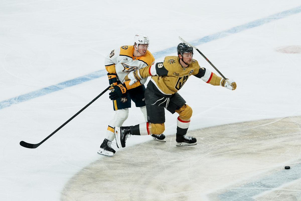 Vegas Golden Knights center Jack Eichel (9) and Nashville Predators left wing Reid Schaefer (49) race to the puck during second period of NHL game against Nashville Predators on Saturday Jan. 17, 2026 at T-Mobile Arena in Las Vegas.
