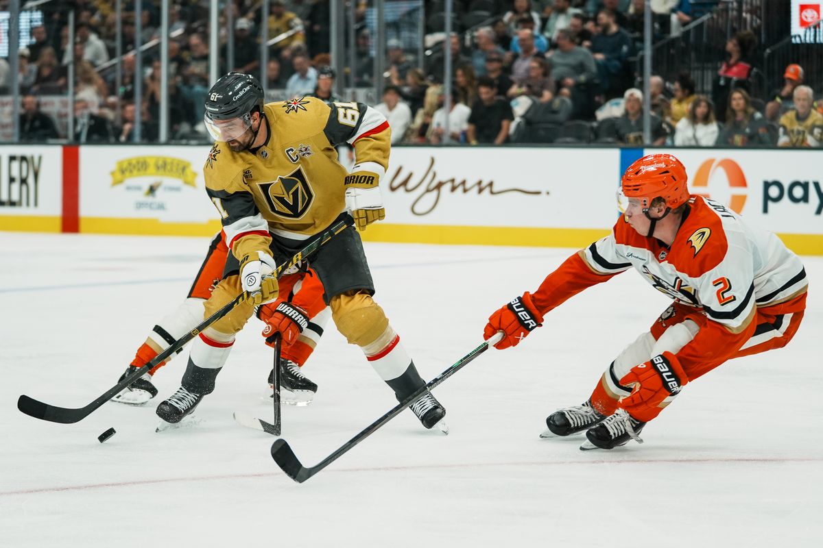 Vegas Golden Knights right wing Mark Stone (61) and Anaheim Ducks defenseman ackson LaCombe (2) reach for the puck during third period of NHL game against Anaheim Ducks on Friday October 2, 2026 at T-Mobile Arena in Las Vegas. Vegas Golden Knights right wing Mark Stone (61) and Anaheim Ducks defenseman ackson LaCombe (2) reach for the puck during third period of NHL game against Anaheim Ducks on Friday October 2, 2026 at T-Mobile Arena in Las Vegas.