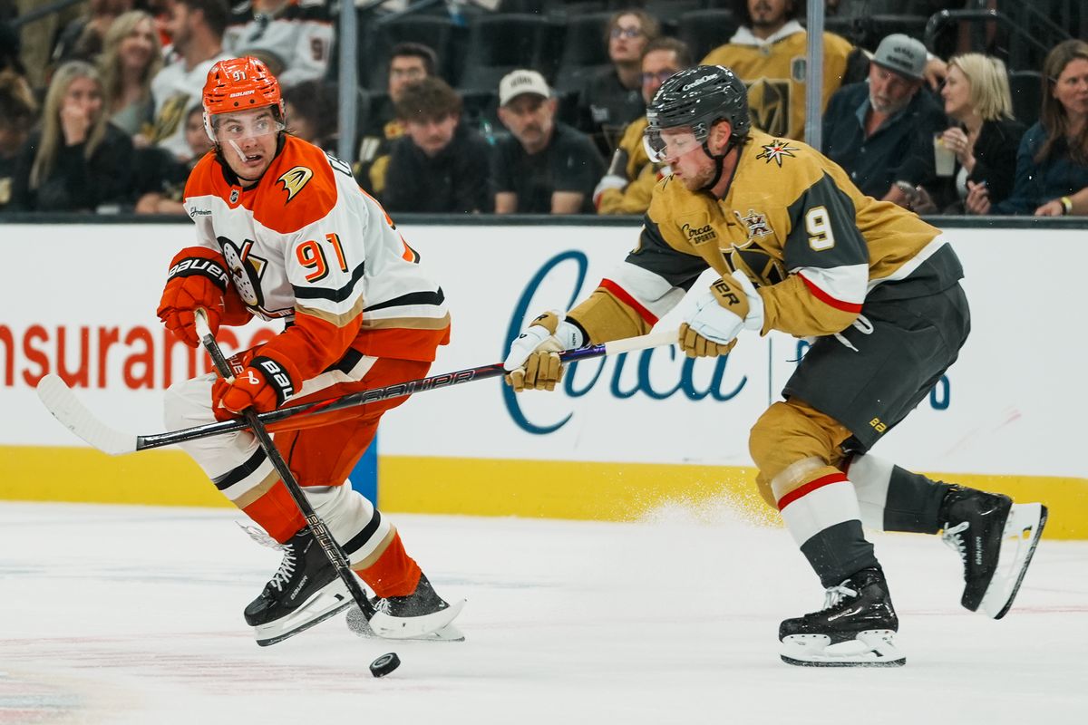 Anaheim Ducks center Leo Carlson (91) attempts to skate the puck away from Golden Knights center Jack Eichel (9) during third period of NHL game against Vegas Golden Knights on Friday October 2, 2026 at T-Mobile Arena in Las Vegas. Anaheim Ducks center Leo Carlson (91) attempts to skate the puck away from Golden Knights center Jack Eichel (9) during third period of NHL game against Vegas Golden Knights on Friday October 2, 2026 at T-Mobile Arena in Las Vegas.