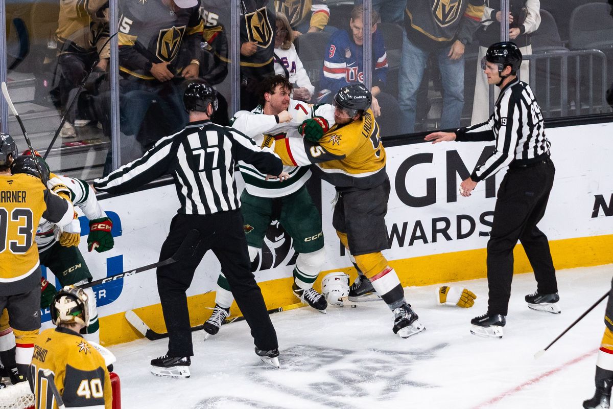 Minnesota Wild defenseman Brock Faber (7) punches Vegas Golden Knights defenseman Jeremy Lauzon (5) during a NHL game between the Vegas Golden Knights and the Minnesota Wild, Friday March 6, 2026 in Las Vegas, Nev.