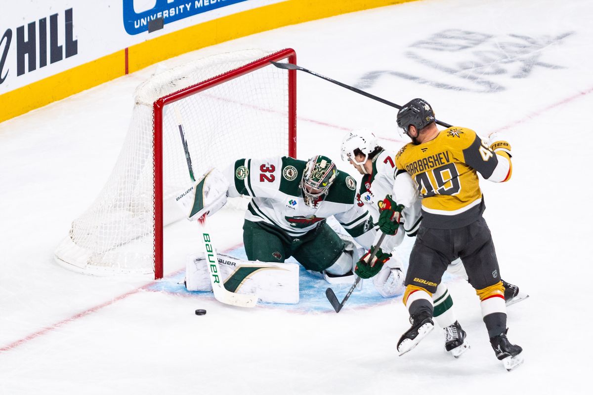 Minnesota Wild goalie Filip Gustavsson (32) blocks a shot from Vegas Golden Knights left-wing Ivan Barbashev (49) during a NHL game between the Vegas Golden Knights and the Minnesota Wild, Friday March 6, 2026 in Las Vegas, Nev.