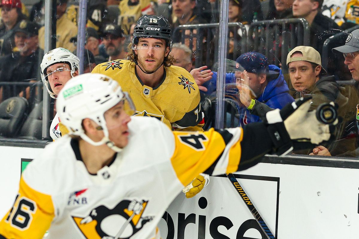 Vegas Golden Knights D Noah Hanifin (15) watches as Pittsburgh Penguins C Blake Lizotte (46) catches the puck during an NHL game on Thursday, March 12, 2026, in Las Vegas, Nevada. 