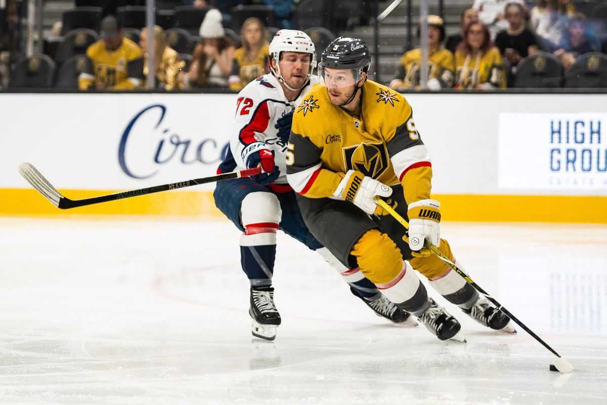 Vegas Golden Knights defenseman Jeremy Lauzon (5) looks to skate the puck out of the zone as Washington Capitals right-wing Anthony Beauvillier (72) defends during a NHL game between the Vegas Golden Knights and the Washington Capitals, Saturday March 28, 2026 in Las Vegas, Nev. Vegas Golden Knights defenseman Jeremy Lauzon (5) looks to skate the puck out of the zone as Washington Capitals right-wing Anthony Beauvillier (72) defends during a NHL game between the Vegas Golden Knights and the Washington Capitals, Saturday March 28, 2026 in Las Vegas, Nev.