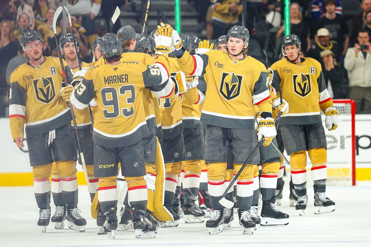 Vegas Golden Knights D Kaedan Korczak (6) high fives his teammates after defeating the Vancouver Canucks on Monday, March 30, 2026, in Las Vegas, Nevada. 