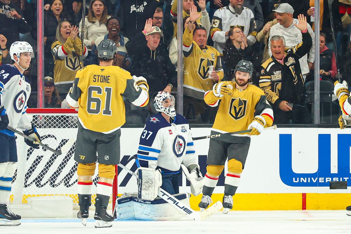 Vegas Golden Knights D Rasmus Andersson (4) points towards his teammate Vegas Golden Knights F Mark Stone (61) after Stone assisted on his goal against the Winnipeg Jets on Monday, April 13, 2026, in Las Vegas, Nevada. 