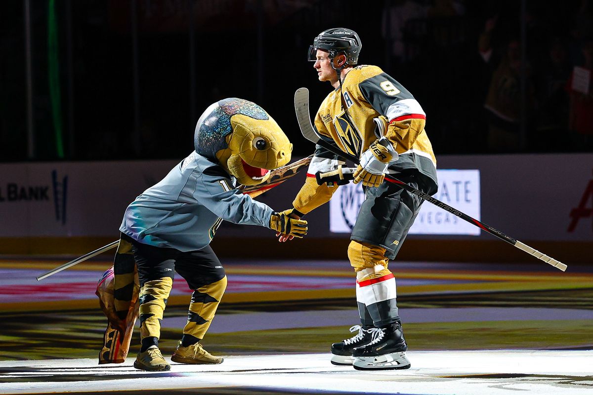 Vegas Golden Knights F Jack Eichel (9) high-fives the Vegas Golden Knights' mascot Chance during the three-stars ceremony after an NHL game against the Winnipeg Jets on Monday, April 13, 2026, in Las Vegas, Nevada. 